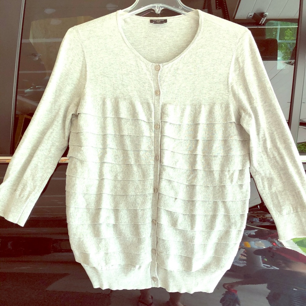 Light gray cardigan.